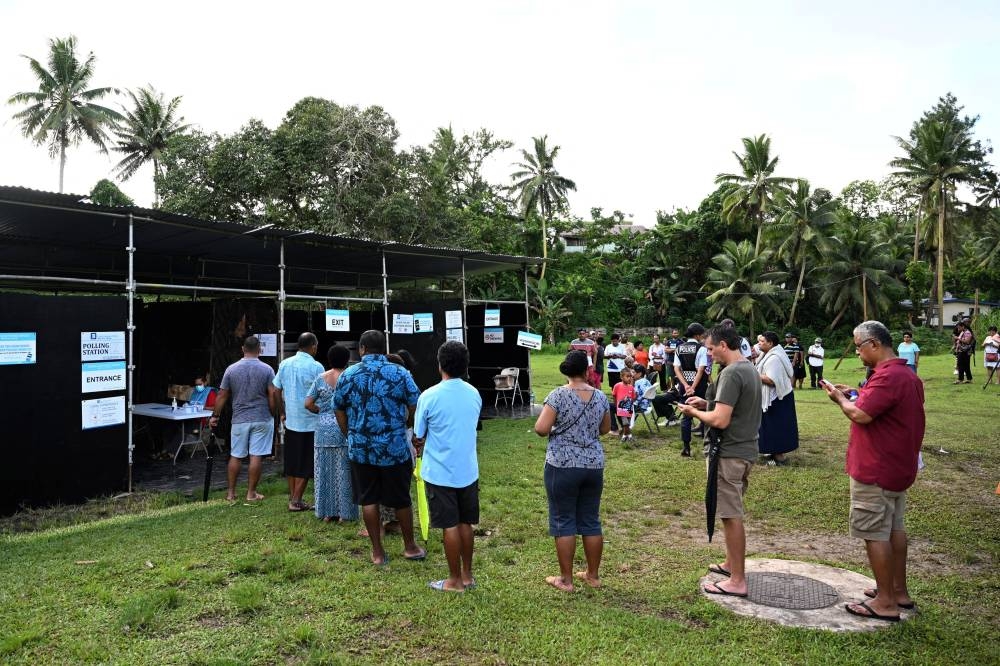 Voters queue at a polling station to vote during the Fijian general election in Suva, Fiji, December 14, 2022. — AAP Image/Mick Tsikas/Reuters pic