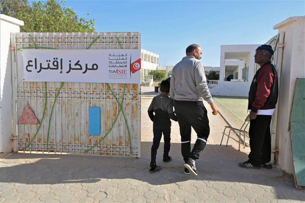 A Tunisian voter leaves a polling station in Tunisia's southern town of Ben Guerdane on December 17, 2022, during the parliamentary election. — AFP pic