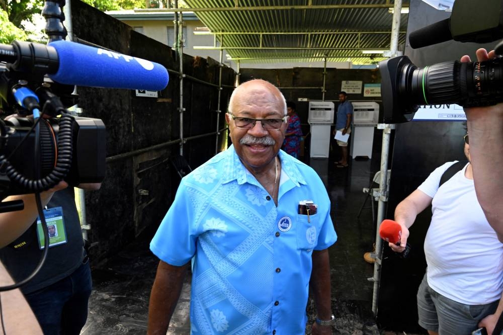 People's Alliance Party leader Sitiveni Rabuka leaves after voting at a polling station during the Fijian general election in Suva, Fiji, December 14, 2022. — AAP Image/Mick Tsikas/Reuters pic