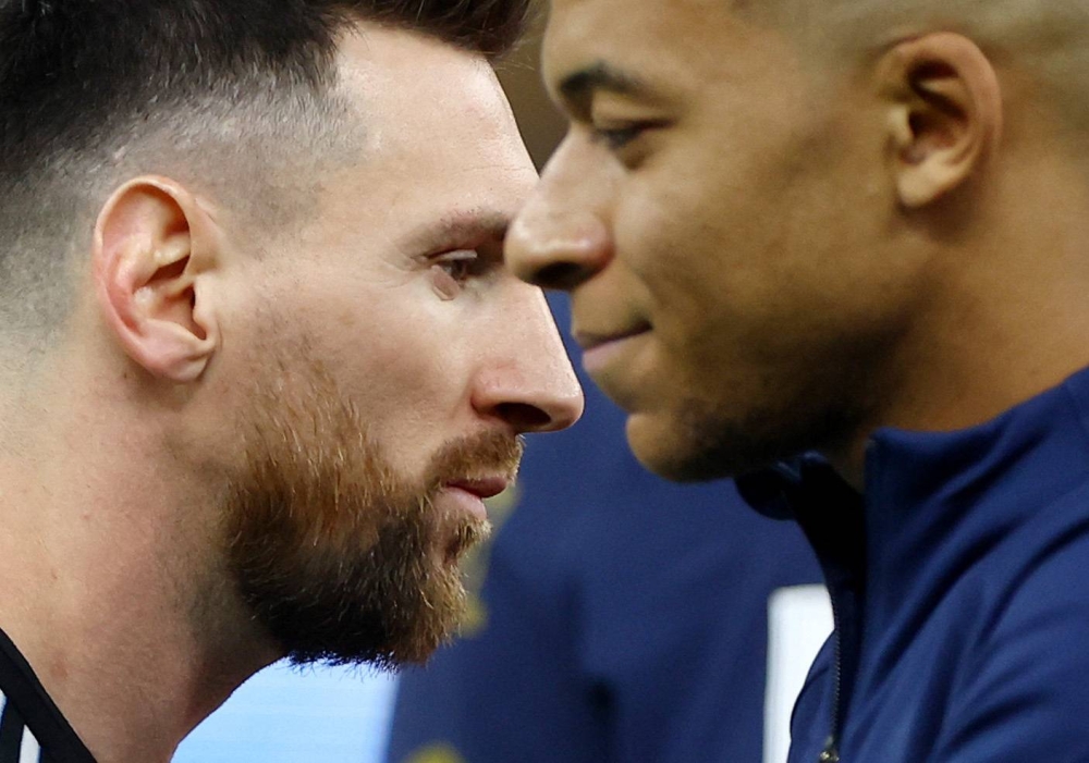 France's Kylian Mbappe and Argentina's Lionel Messi before the World Cup finals match at Lusail Stadium, Lusail, Qatar December 18, 2022. — Reuters pic