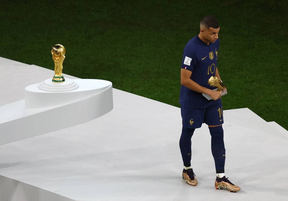 France's Kylian Mbappe with the Golden Boot award after the Qatar 2022 World Cup final against Argentina at the Lusail Stadium December 18, 2022. — Reuters pic