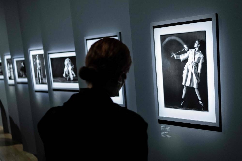 In this picture taken on December 19, 2022, a guest visits the exhibition ‘Christian Dior: Designer of Dreams’ during a media preview at the Museum of Contemporary Art Tokyo in Tokyo. — AFP pic