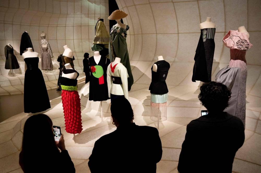 In this picture taken on December 19, 2022, guests visit the exhibition ‘Christian Dior: Designer of Dreams’ during a media preview at the Museum of Contemporary Art Tokyo in Tokyo. — AFP pic