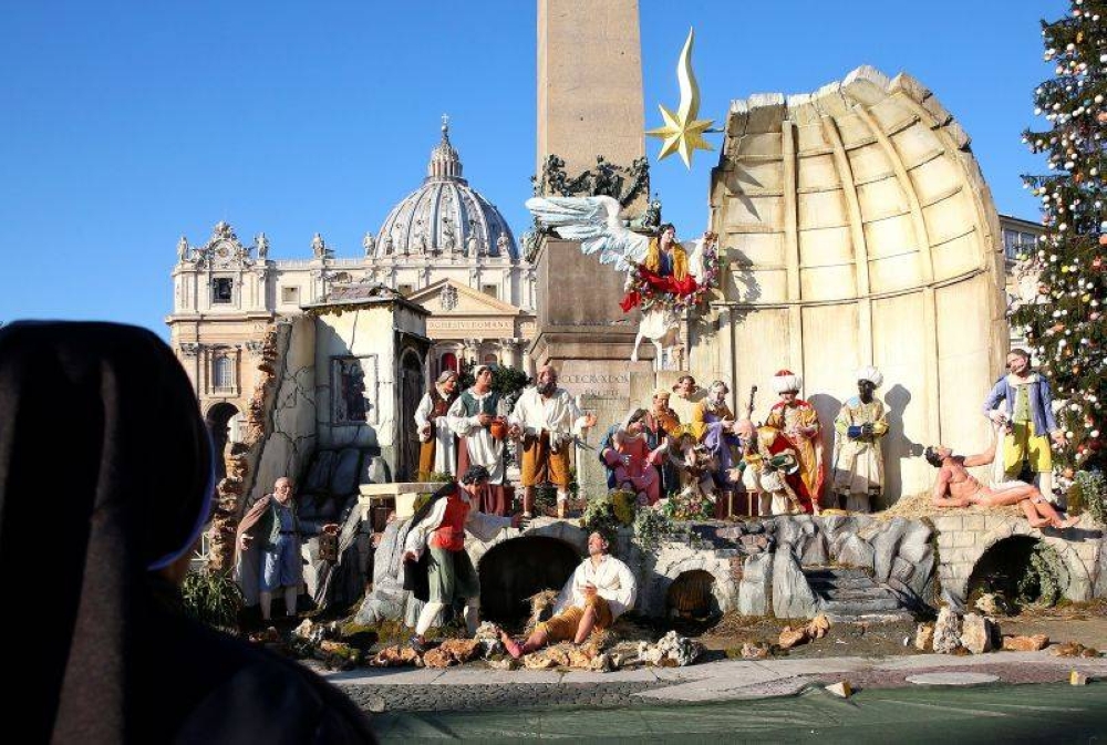 A nun looks at Nativity scene in Saint Peter's square in the Vatican December 26, 2017. — Reuters pic