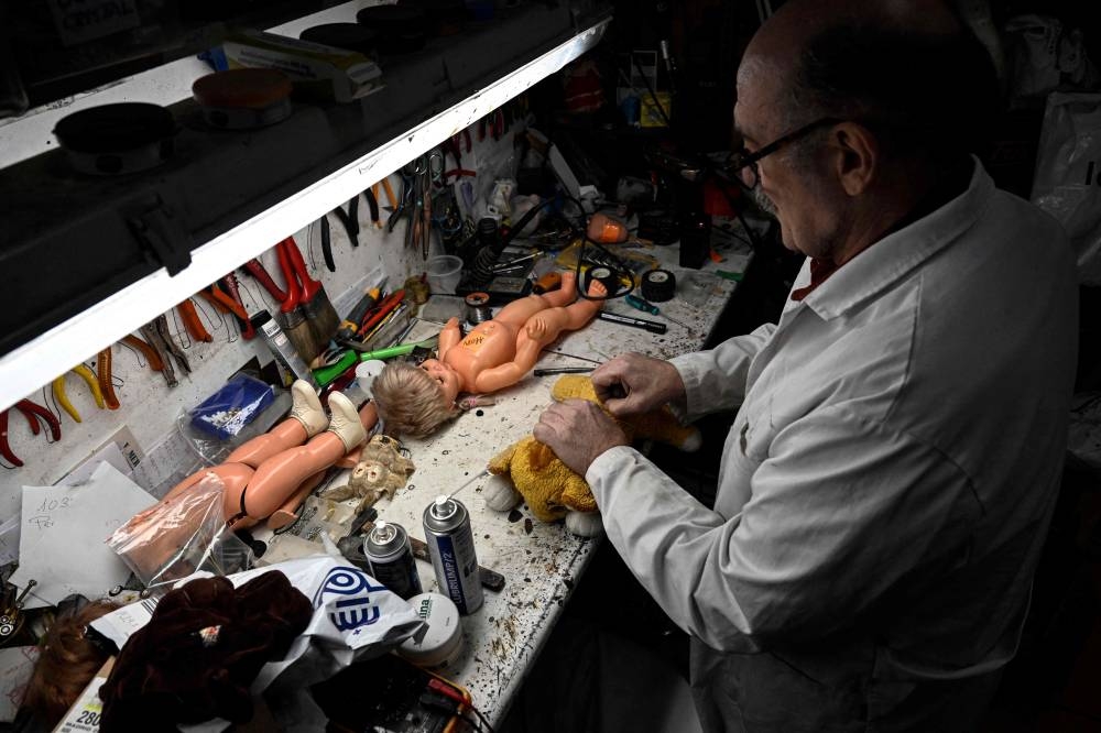 Antonio Martinez Rivas, 70 years old, works at his workshop 
