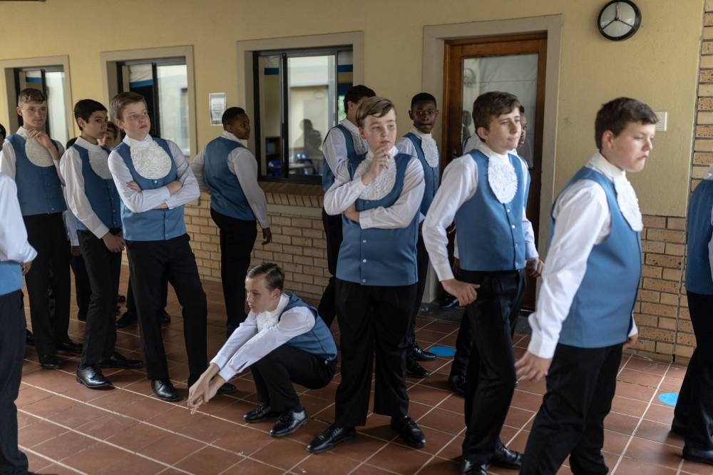 Students from the Drakensberg Boys Choir line up before singing in a Christmas function at the school near Winterton on December 10, 2022. — AFP pic