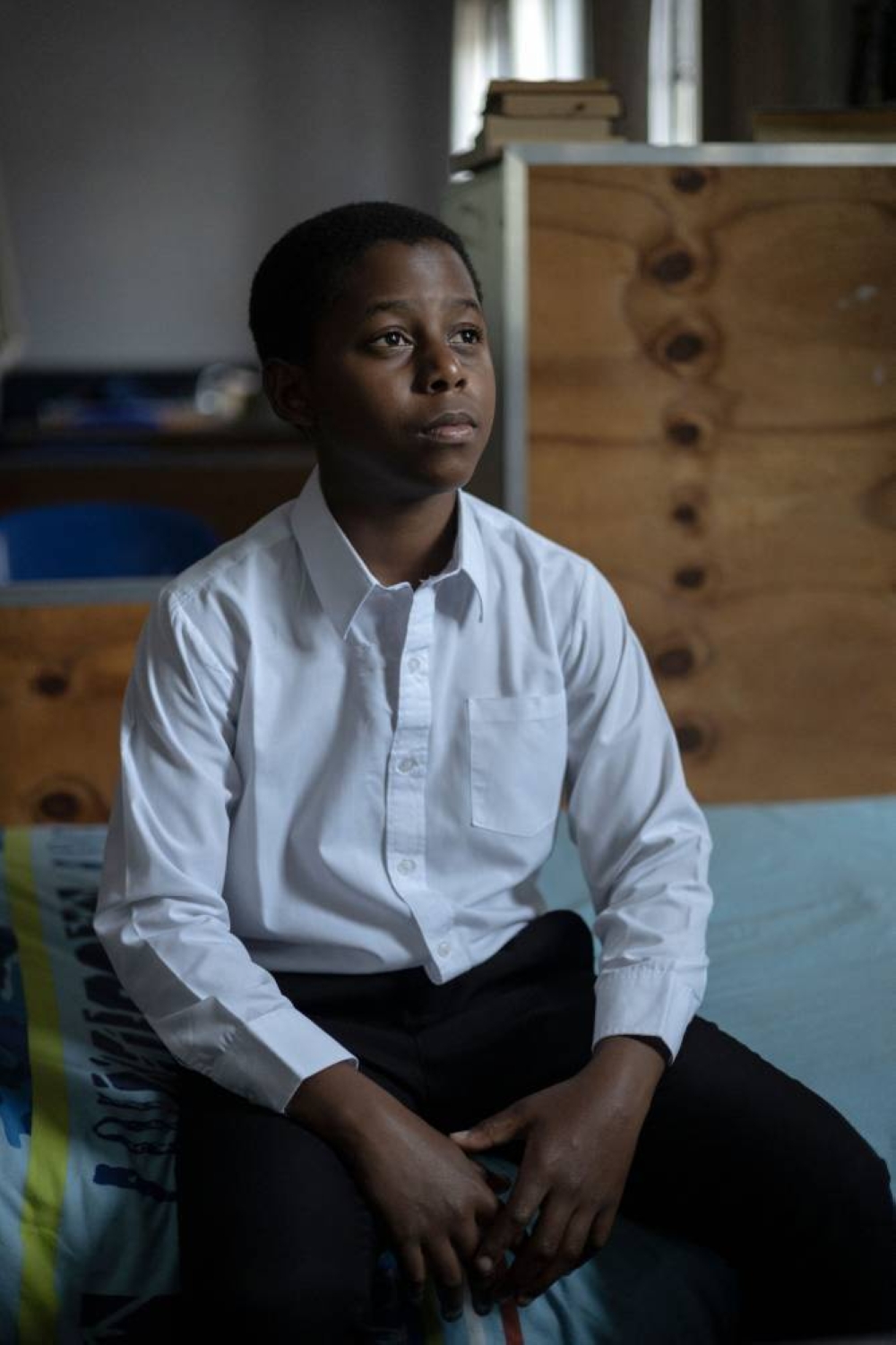 Ethan Palagangwe, a student at the Drakensberg Boys Choir School, poses for a portrait in his bedroom near Winterton on December 9, 2022. — AFP pic