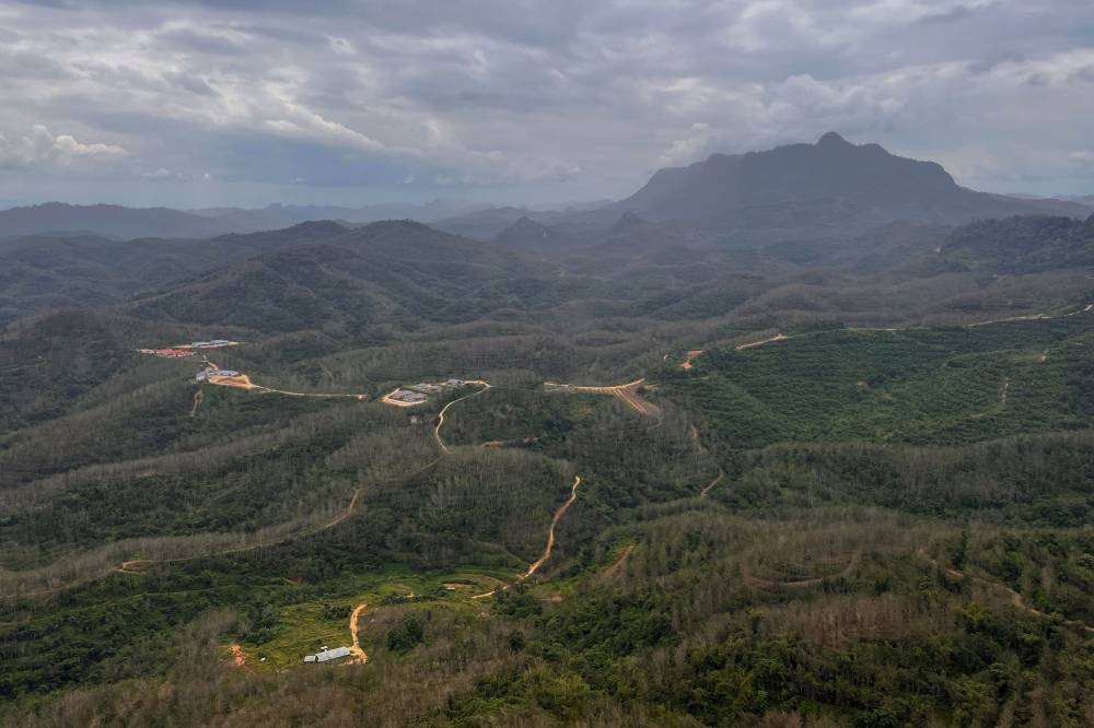An aerial view of the Pos Balar Orang Asli settlement in Gua Musang December 28, 2022. The Orang Asli Development Department (Jakoa) will build an alternative route for the more than 1,000 villagers of the Pos Balar Orang Asli settlement whose road link to town has been cut off by a landslide. — Bernama pic