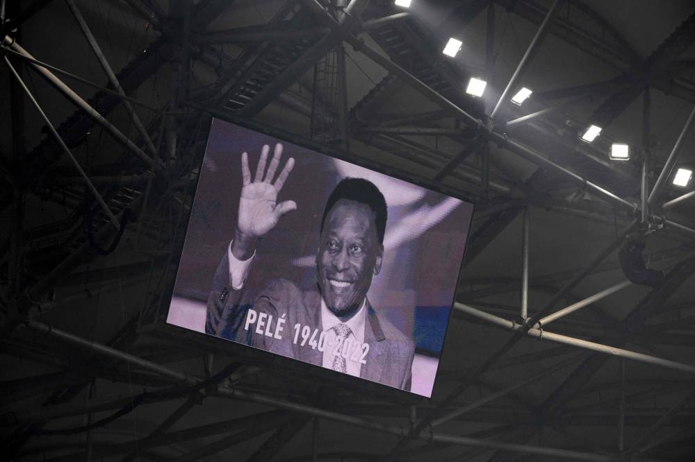 A photograph of Brazilian football legend Pele is displayed on a giant screen prior to the French L1 football match between Olympique de Marseille and Toulouse FC at the Velodrome stadium in Marseille on December 29, 2022. — AFP pic
