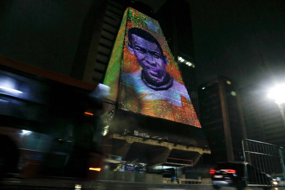 An image of Brazilian football legend Pele, whose death was announced earlier in the day, is displayed at the headquarters of the Federation of the Industries of the State of Sao Paulo (FIESP) in Sao Paulo, Brazil, on December 29, 2022. — AFP pic