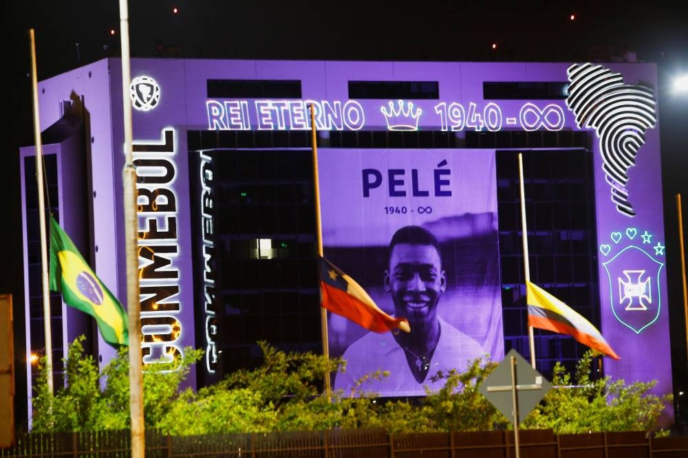 An image of Brazilian football legend Pele is displayed on the South American Football Confederation building, in Luque, Paraguay December 29, 2022. — Reuters pic