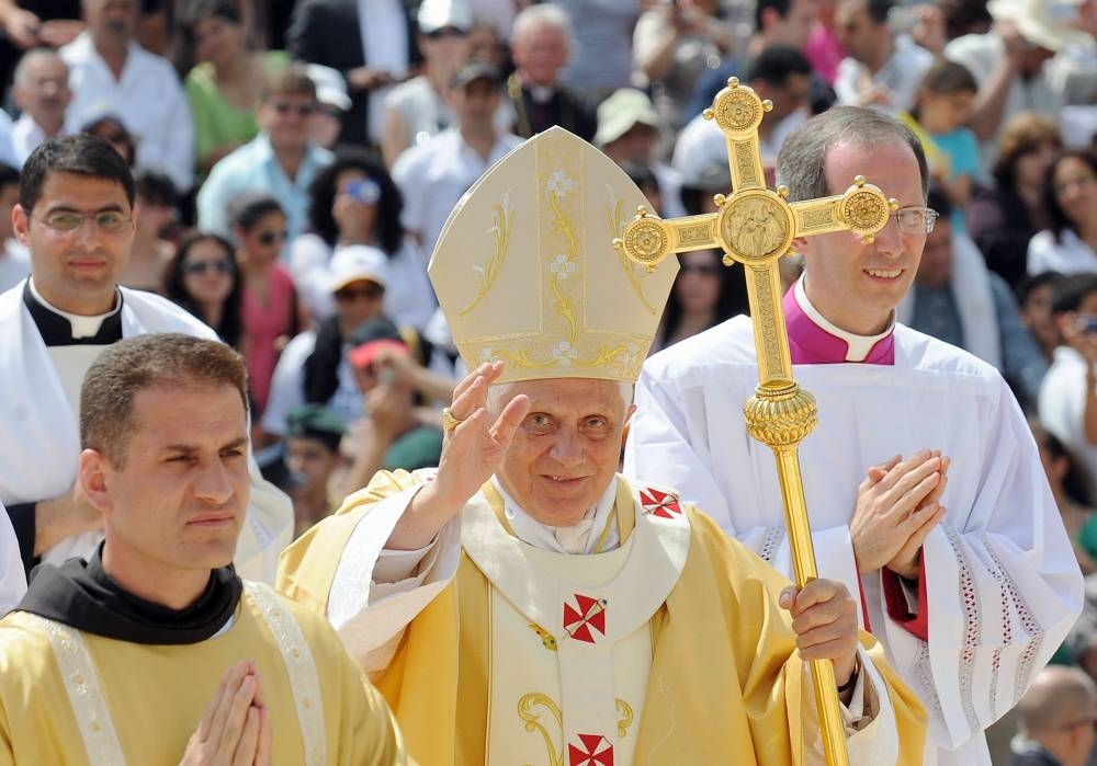 In this file photograph taken on May 14, 2009, Pope Benedict XVI waves as he arrives to celebrate mass on Mount Precipice, just outside the city of Nazareth, the boyhood town of Jesus that is now an Arab-Israeli city. — AFP pic