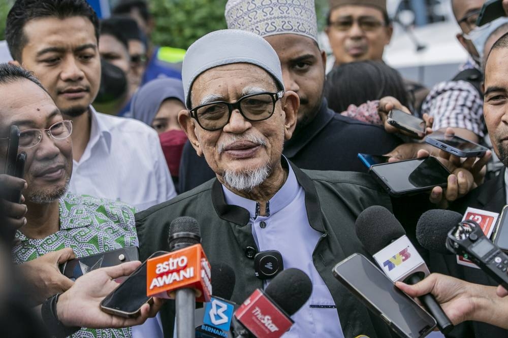 File picture shows PAS president Tan Sri Abdul Hadi Awang speaking to the media after giving a statement at IPD Sentul, Kuala Lumpur December 5, 2022. — Picture by Hari Anggara