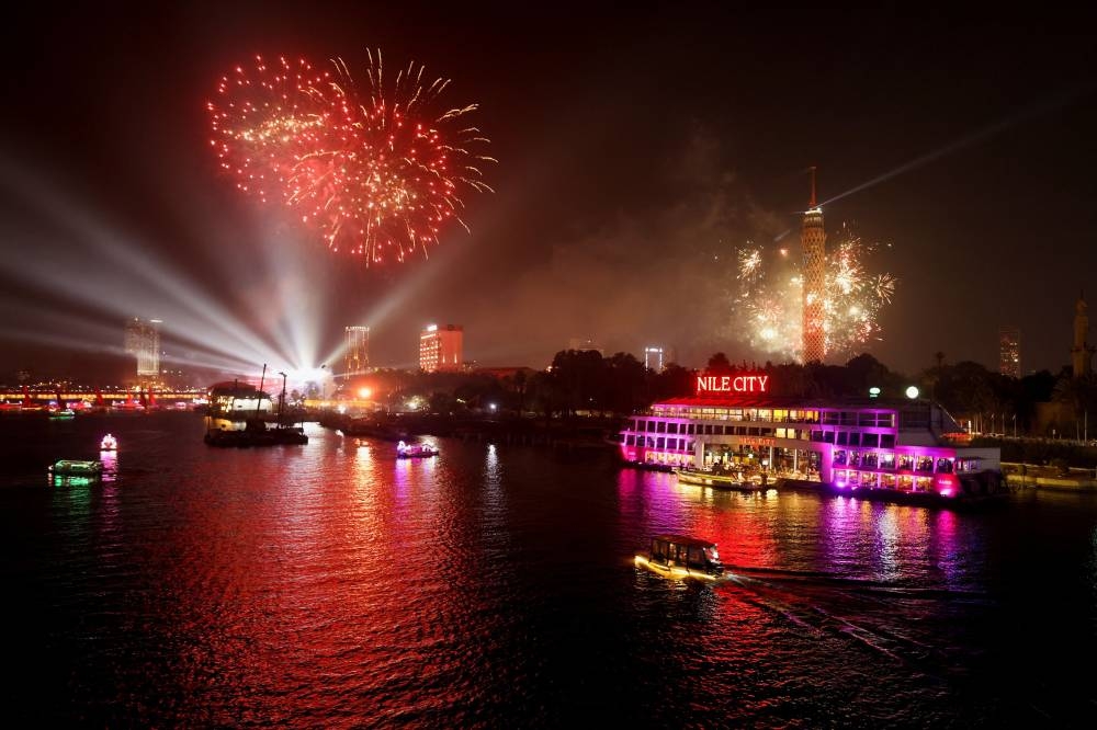 Fireworks explode over the Nile River during the New Year celebrations, in Cairo, Egypt, January 1, 2023. — Reuters pic
