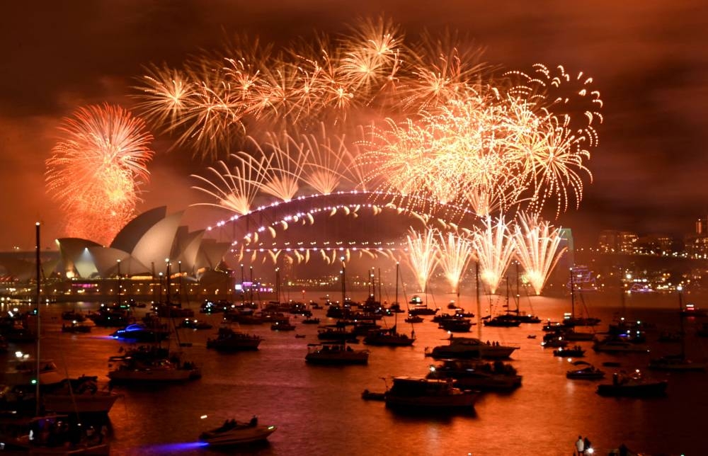 Fireworks explode over Sydney Harbour during the New Year's Eve celebrations in Sydney, Australia, January 1, 2023. — Reuters pic