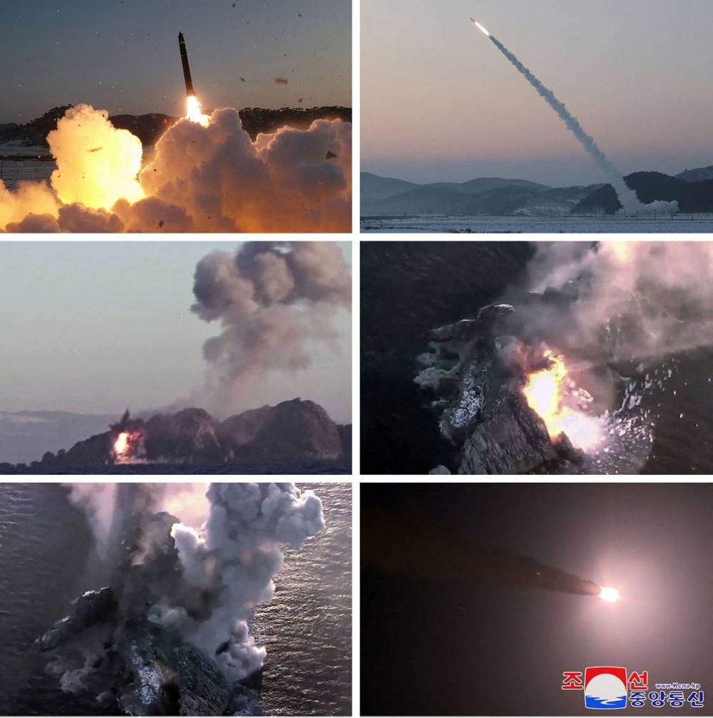 This combination of pictures taken on December 31, 2022 and released from North Korea's official Korean Central News Agency (KCNA) on January 1, 2023 shows a test-fire of the super-large multiple rocket launchers being conducted by the North Korean's Second Economic Commission at undisclosed locations. — KCNA pic via AFP 