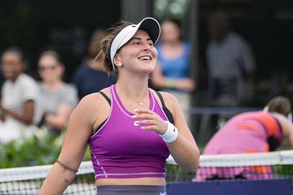Canadian Bianca Andreescu celebrates winning her first round match against Spanish player Garbine Muguruza in the WTA Adelaide International tournament in Adelaide on January 1, 2023. — AFP pic