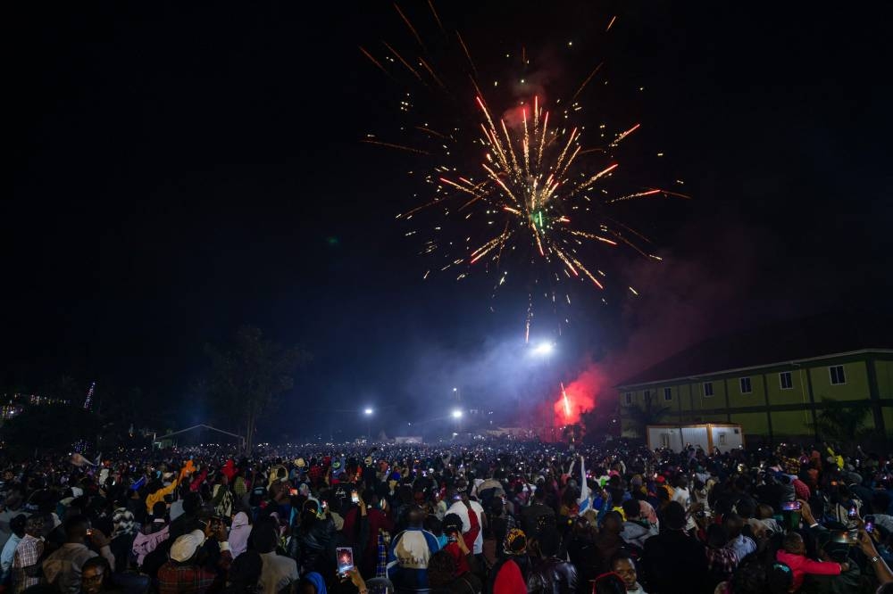 The party-goers were killed at Freedom City mall in Kampala as revellers thronged a single exit to watch a midnight fireworks show. — AFP pic