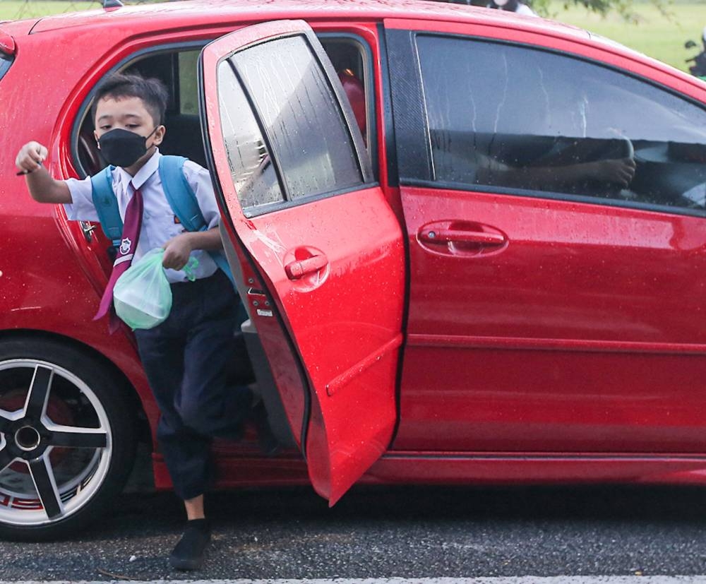 Why are our children putting up with the school tie when our Members of Parliament attending the second day of the Dewan Rakyat Session on December 20 were exempted from wearing neckties? — Picture by Farhan Najib
