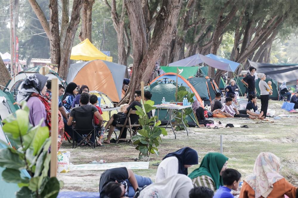 Revellers spend their New Year by camping on the beach as they celebrate the last few days of the school holidays at Bagan Lalang, Kuala Selangor January 1, 2023. — Picture by Sayuti Zainudin