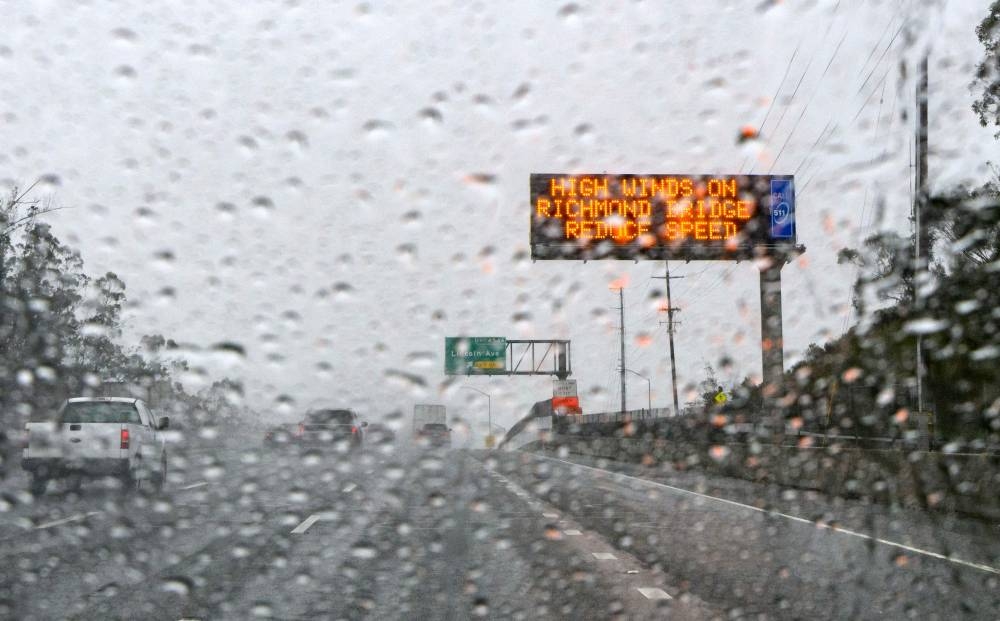 A traffic sign warns of inclement weather in San Rafael, California, on January 04, 2023. — AFP pic