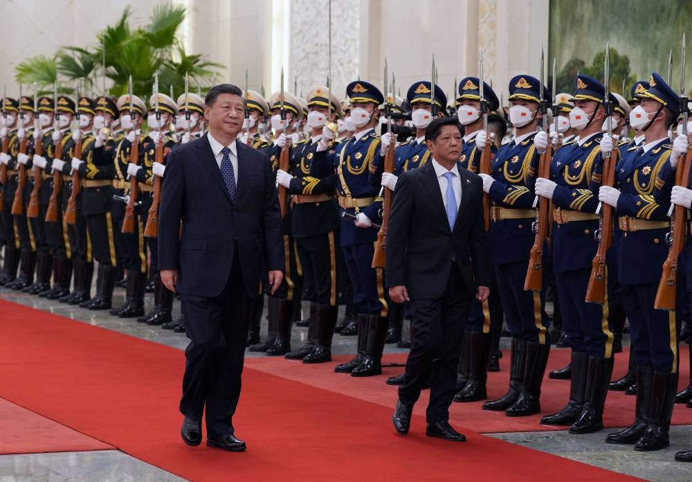 Chinese President Xi Jinping and Philippine President Ferdinand Marcos Jr review the honour guard during a welcome ceremony at the Great Hall of the People in Beijing, China January 4, 2023. — cnsphoto via Reuters 