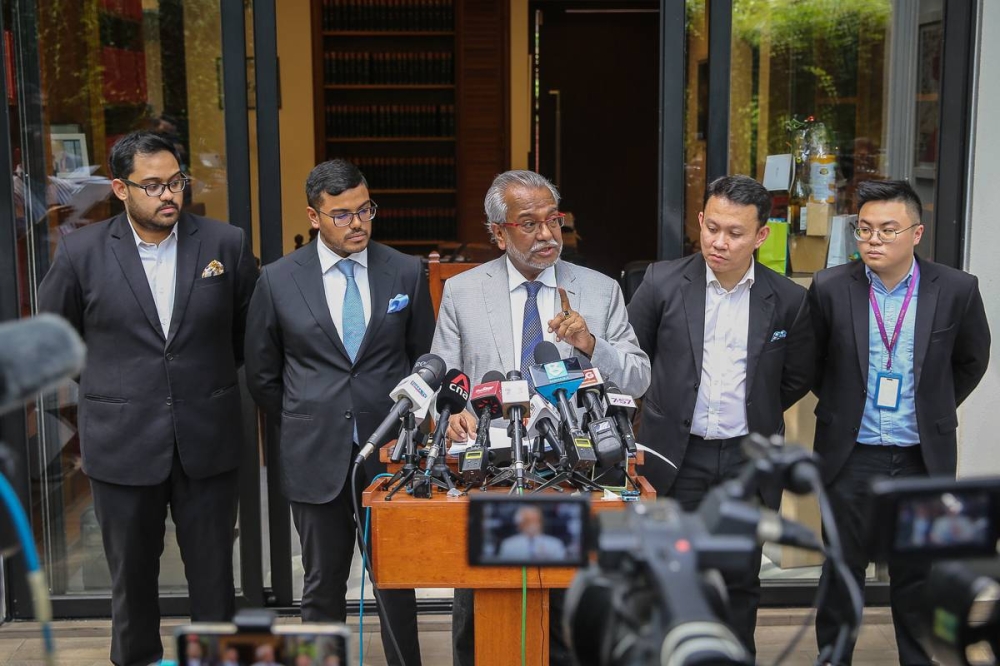 Lawyer Tan Sri Muhammad Shafee Abdullah addresses reporters during a press conference at his office in Kuala Lumpur January 5, 2023. —  Picture by Yusof Mat Isa