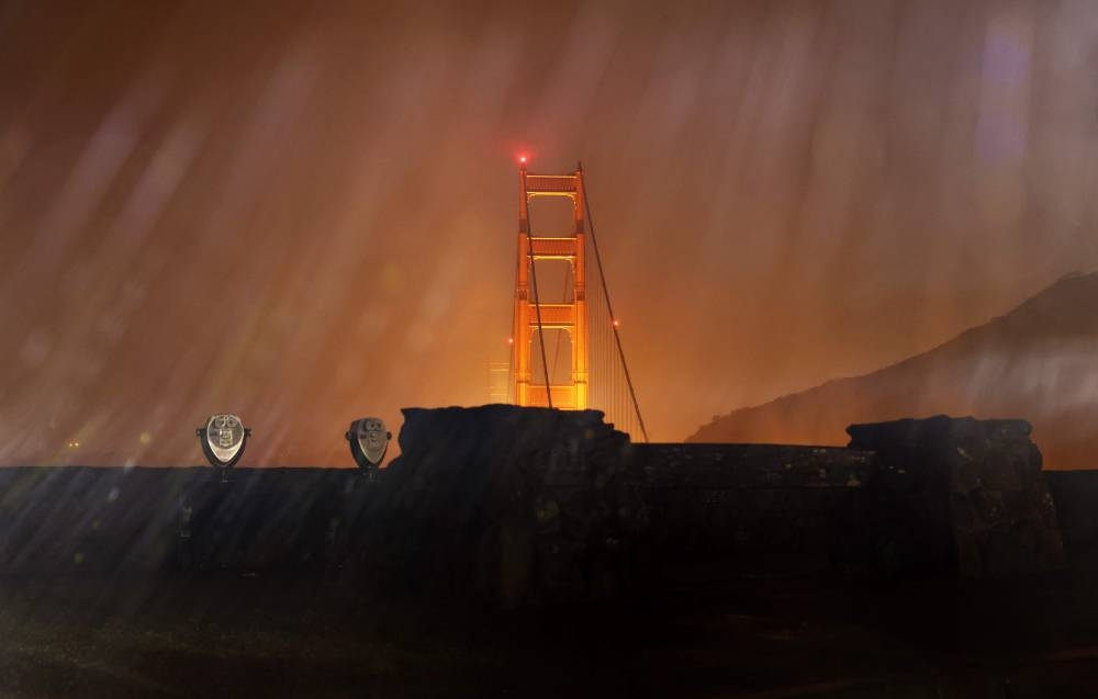 The Golden Gate Bridge is seen through heavy rain on January 4, 2023 in Sausalito, California. A massive storm is hitting Northern California bringing flooding rains and damaging wind. — Justin Sullivan/Getty Images/AFP pic