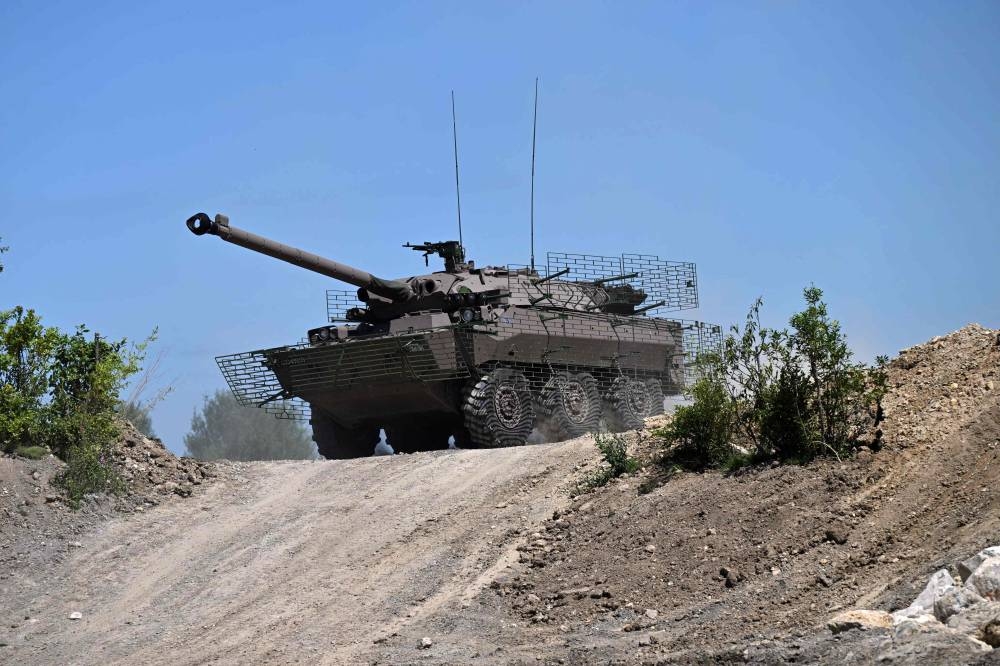 In this file photo taken on June 12, 2022 French army soldiers ride in an AMX-10 RC armoured vehicle as they take part in a demonstration at the Eurosatory international land and airland defence and security trade fair, in Villepinte, a northern suburb of Paris. France is set to become the first Western country to deliver tanks to Ukraine, the French presidency announced on January 4, 2022 after talks between Emmanuel Macron and Ukrainian counterpart Volodymyr Zelenskiy.  — Reuters pic