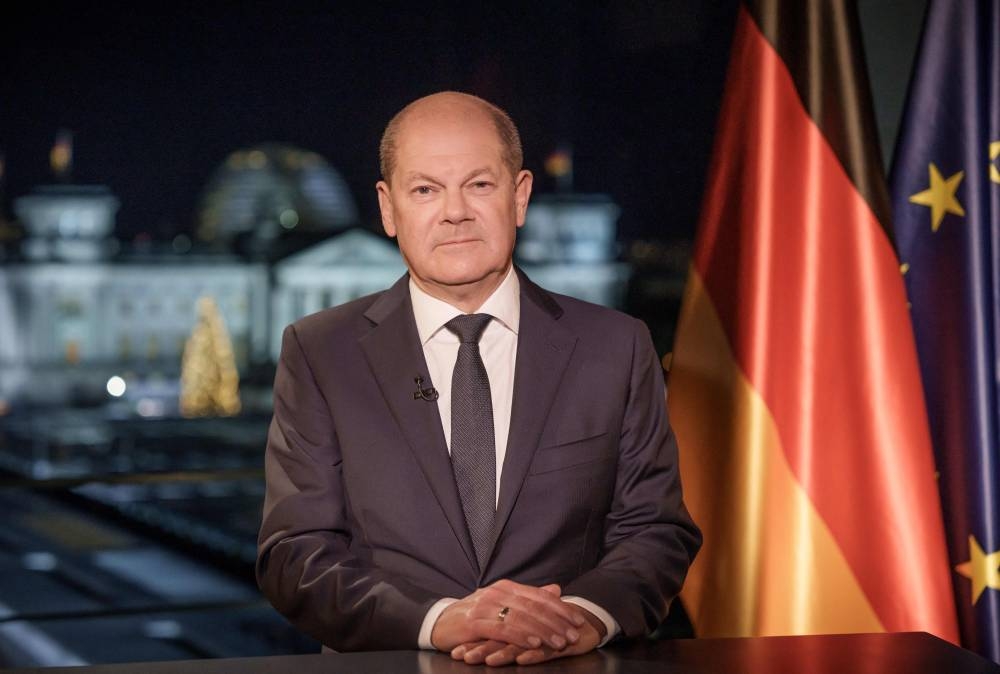 German Chancellor Olaf Scholz poses for photographs during the recording of his New Year's speech at the Chancellery in Berlin, on December 30, 2022. — Michael Kappeler/Pool/AFP pic
