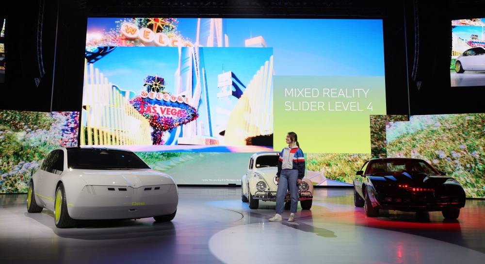 (From left) The BMW i Vision Dee (Digital Emotional Experience) concept EV sport sedan is introduced onstage next to a Herbie, the Love Bug 1963 Volkswagen Beetle and a KITT (Knight Industries Two Thousand) 1982 Pontiac Trans Am from the television series ‘Knight Rider’ during a keynote address by Chairman of the Board of Management of BMW AG Oliver Zipse at CES 2023 at The Pearl concert theater at Palms Casino Resort on January 4, 2023 in Las Vegas, Nevada. — Ethan Miller/Getty Images via AFP pic