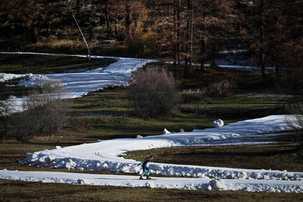 In this file photo taken on November 6, 2022 A skier practises Nordic skiing in the small Savoyard village of Bessans. — AFP pic