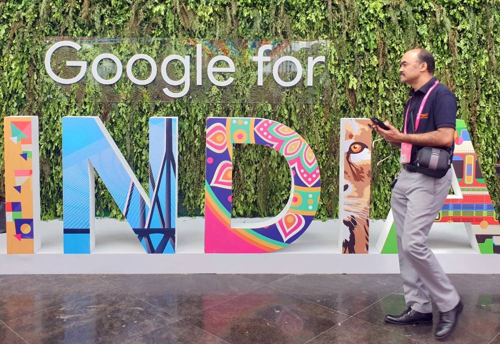 File photo of a man walks past the sign of ‘Google for India’, the company’s annual technology event in New Delhi, India, September 19, 2019. — Reuters pic