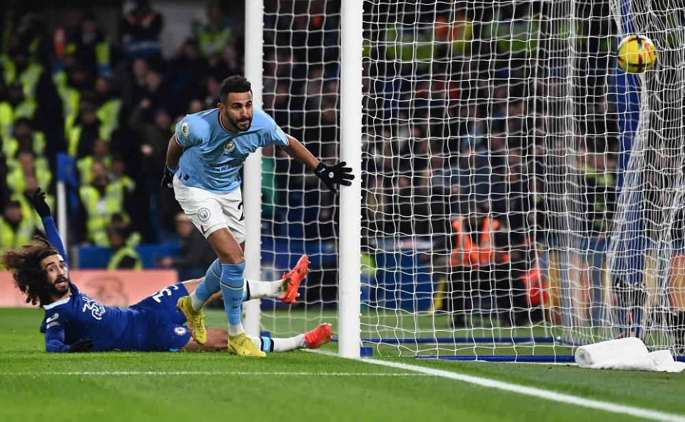 Manchester City's Algerian midfielder Riyad Mahrez celebrates scoring the opening goal during the English Premier League football match between Chelsea and Manchester City at Stamford Bridge in London on January 5, 2023. — Glyn Kirk / IKImages / AFP pic