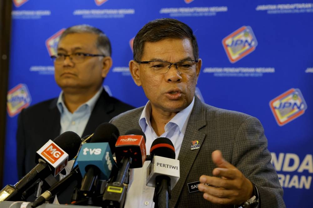 Home Minister Datuk Seri Saifuddin Nasution Ismail speaks during a press conference at the National Registration Department in Putrajaya January 9, 2023. — Bernama pic