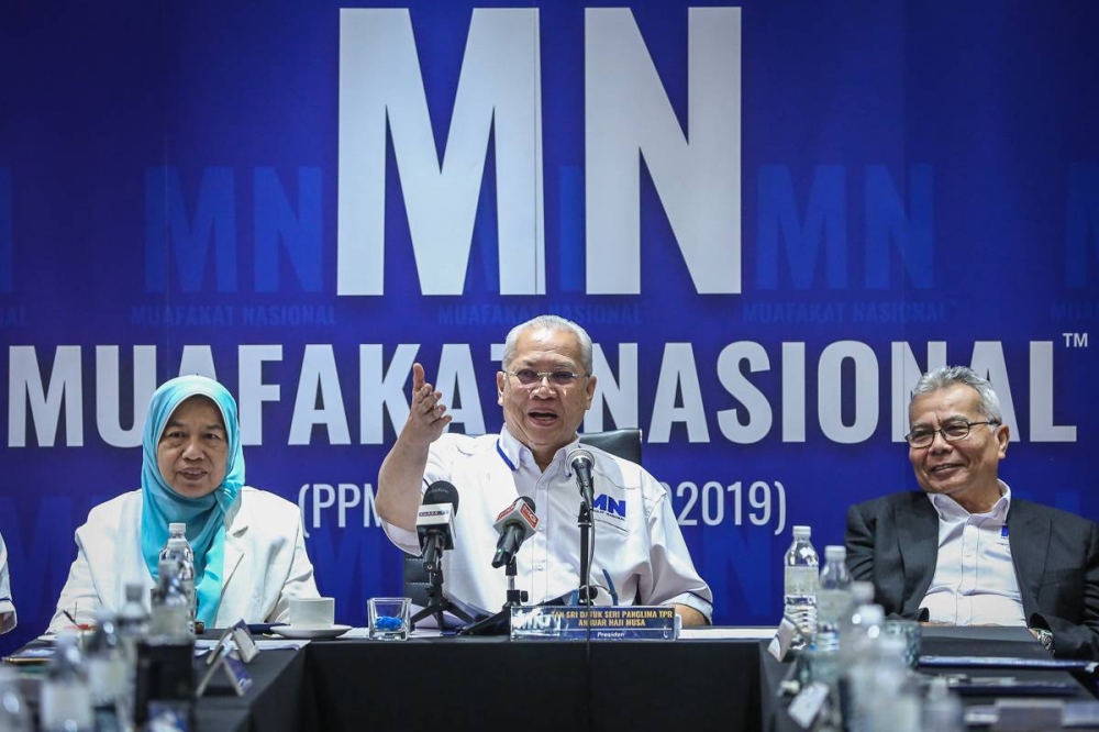 Muafakat Nasional president Tan Sri Annuar Musa (centre) speaks during a news conference at the Dorsett Hotel in Kuala Lumpur January 7, 2023. — Picture by Yusof Mat Isa