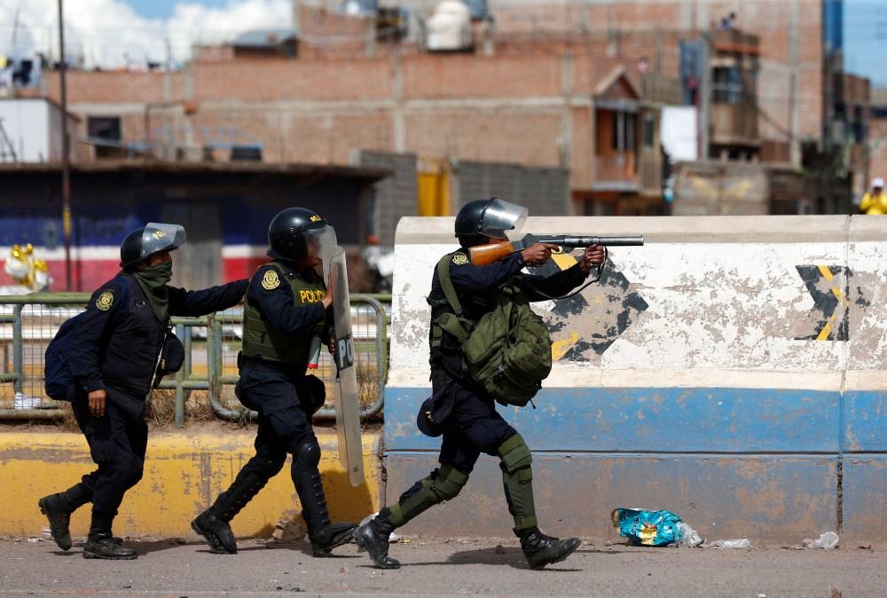 Peruvian police officers operate as demonstrators hold a protest demanding early elections and the release of Peruvian ousted leader Pedro Castillo, in Juliaca, Peru January 8, 2023. ― Reuters pic