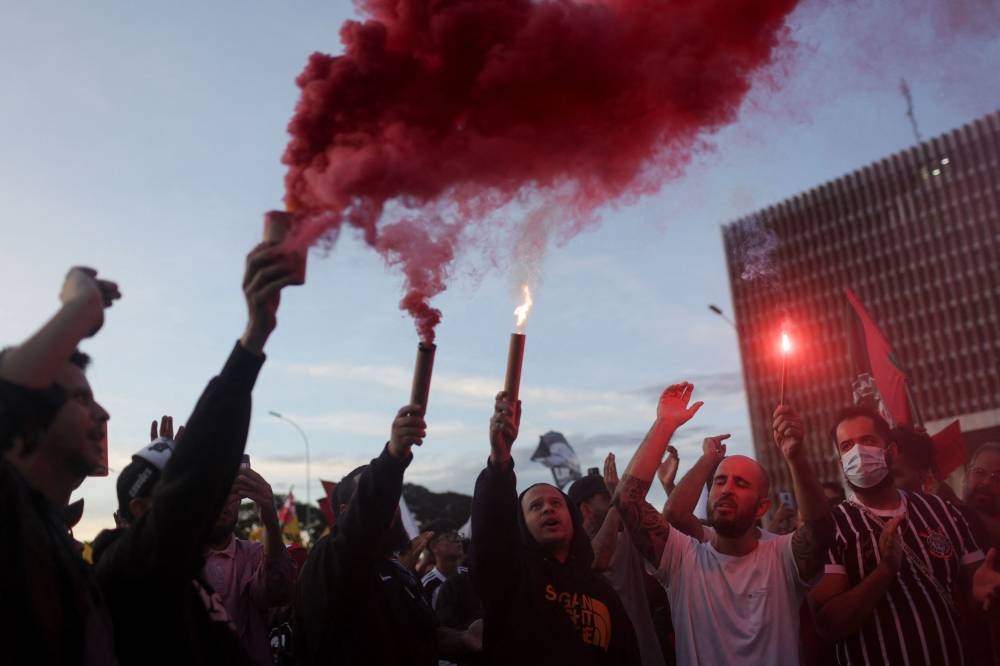 People take part in a pro-democracy demonstration, after thousands of supporters of far-right former President Jair Bolsonaro stormed Brazil's Congress, the Supreme Court and the presidential palace, in Brasilia, Brazil January 9, 2023. ― Reuters pic