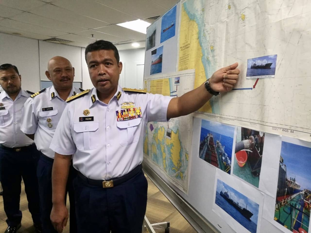 Johor Malaysian Maritime Enforcement Agency (MMEA) director Maritime First Admiral Nurul Hizam Zakaria shows the vessels detained under the operation carried out in the waters off Kota Tinggi during a press conference at the Johor MMEA headquarters in Menara Tabung Haji in Johor Baru January 10, 2023. — Picture by Ben Tan
