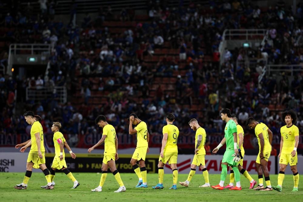Harimau Malaya players look dejected after losing 0-3 against defending champions Thailand. ― Bernama pic