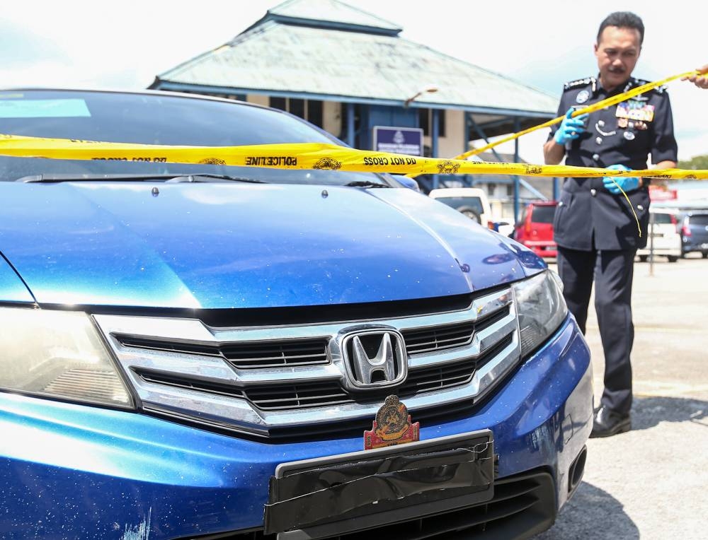 Perak police chief Datuk Seri Mohd Yusri Hassan Basri  showing the car that was confiscated following a drug bust in Kampar, at the Perak police headquarters in Ipoh January 11, 2023.