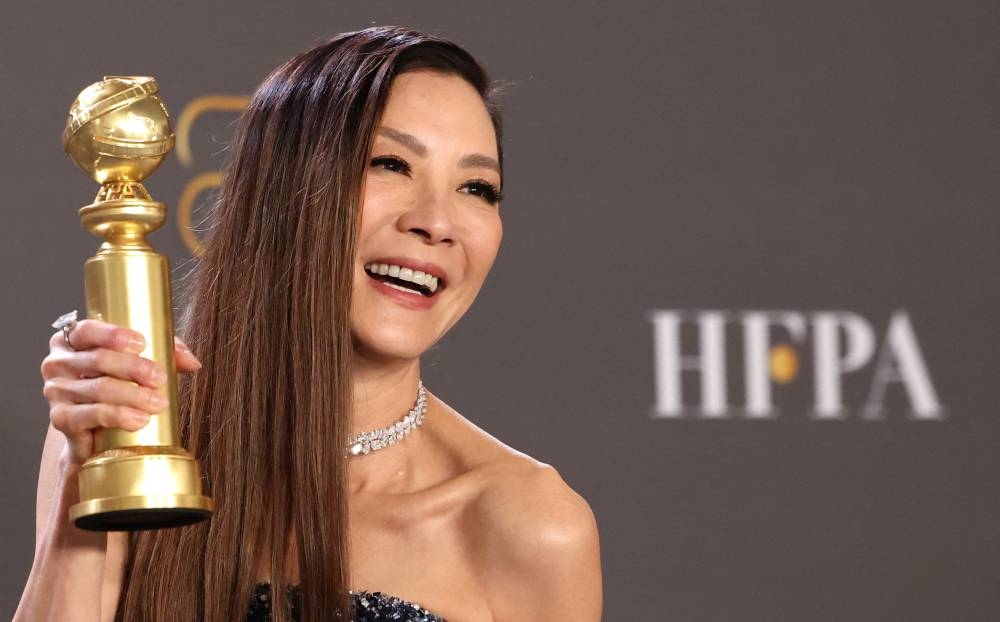 Tan Sri Michelle Yeoh poses with her award for Best Actress in a Musical or Comedy Motion Picture for ‘Everything Everywhere All at Once’ at the Golden Globe Awards. ― Reuters pic