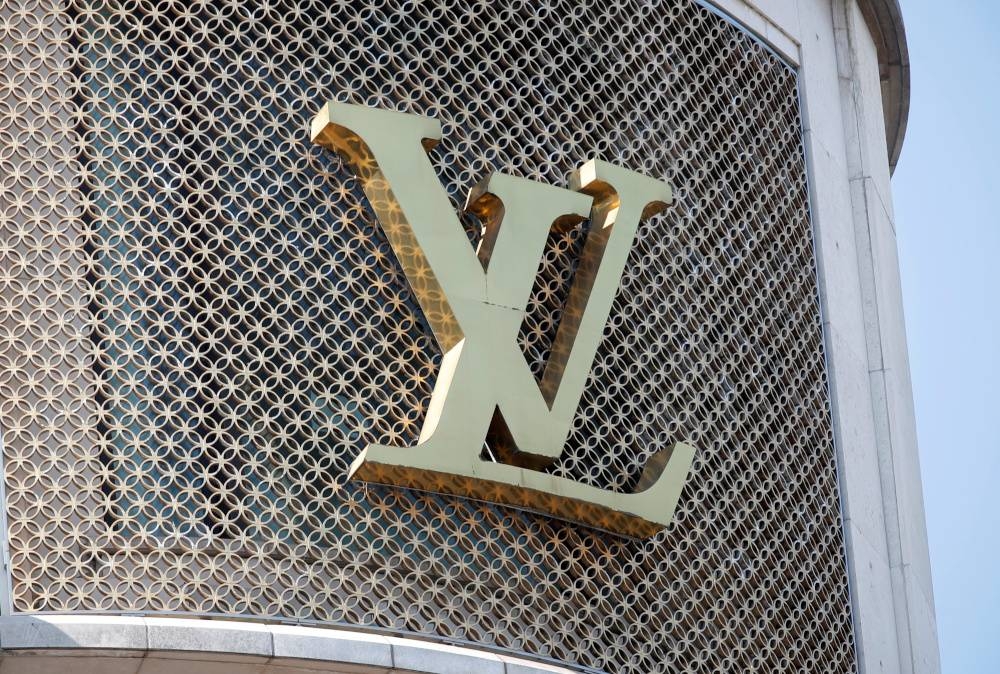 A Louis Vuitton logo is seen outside a store on the Champs-Elysees in Paris, France, September 18, 2020. — Reuters pic