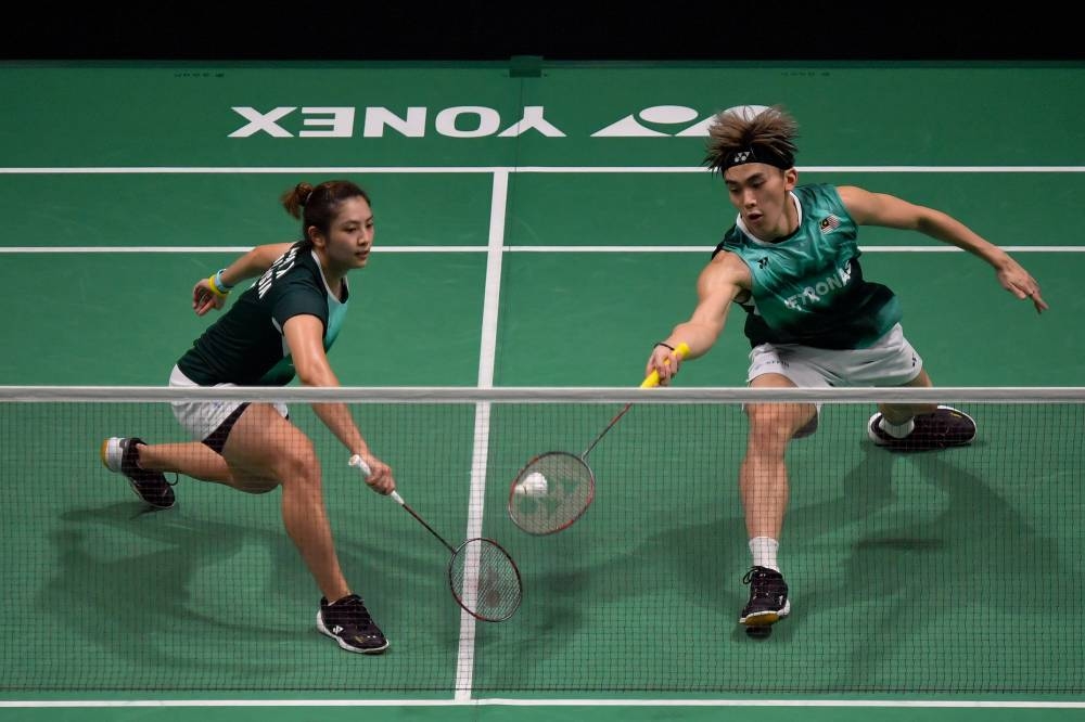 Mei Kee (left), who confirmed her spot in the mixed doubles with Hoo Pang Ron yesterday, guided Go Pei Kee, 20, to clear women's doubles first round today. — Bernama pic