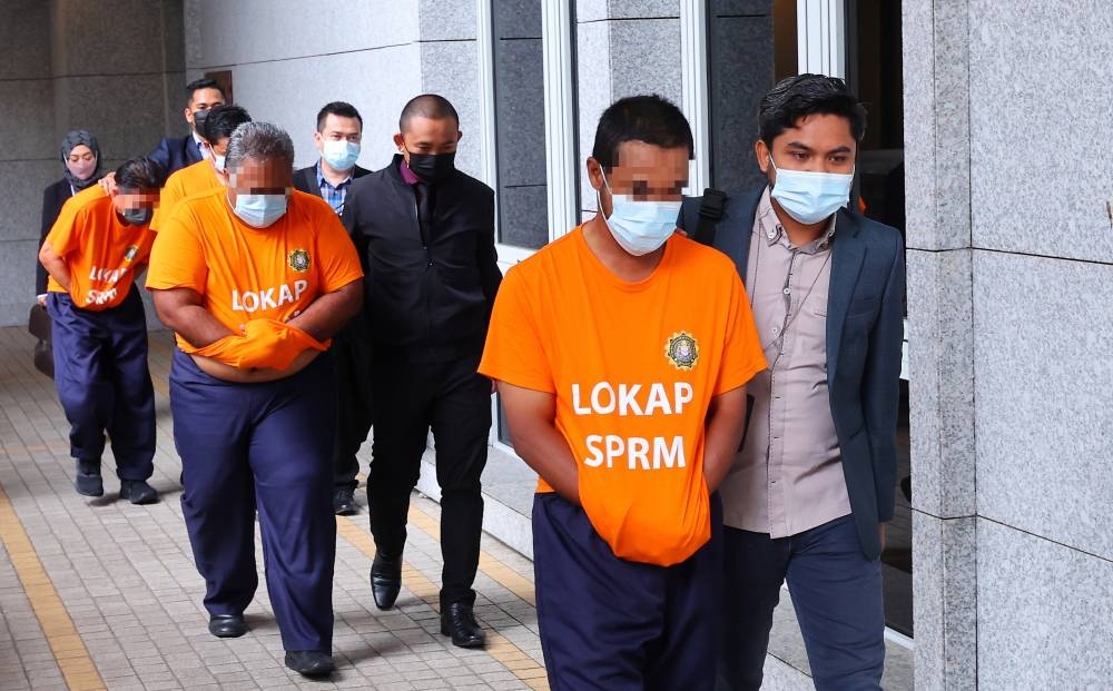 The men, aged between 38 and 65, were arrested at its headquarters in Putrajaya yesterday afternoon when they turned up to have their statements recorded. — Bernama pic