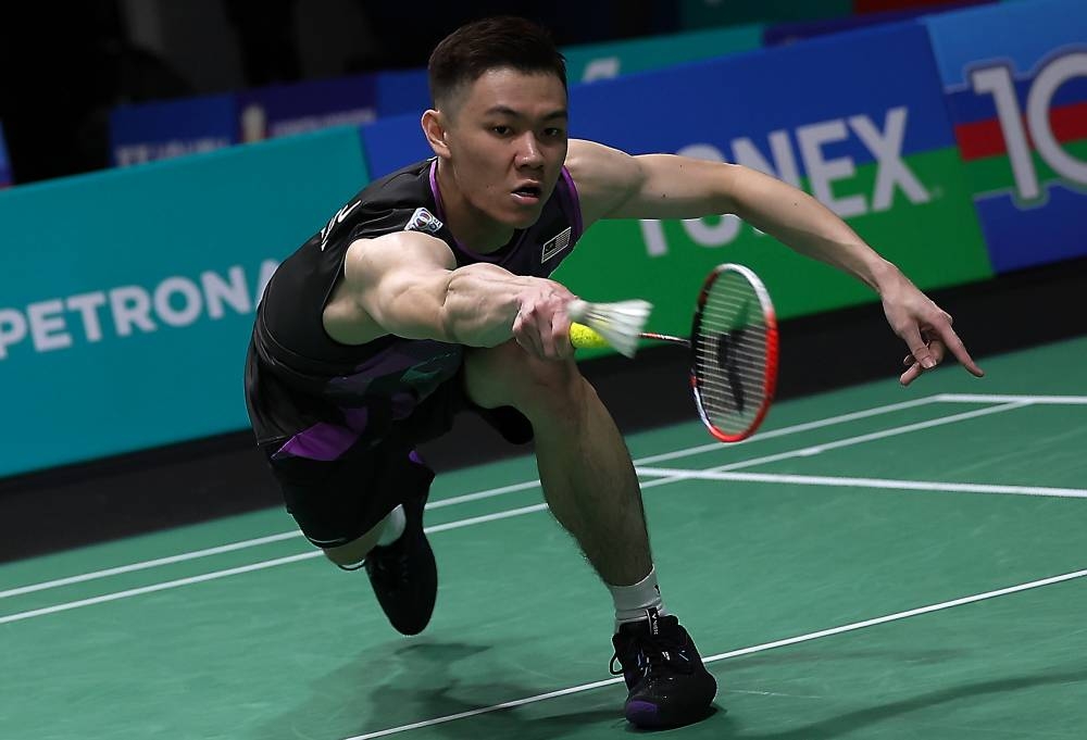 Lee suffered a humiliating 21-13, 17-21, 19-21 loss at the hands of Japan's Kodai Naraoka at the Axiata Arena. — Bernama pic