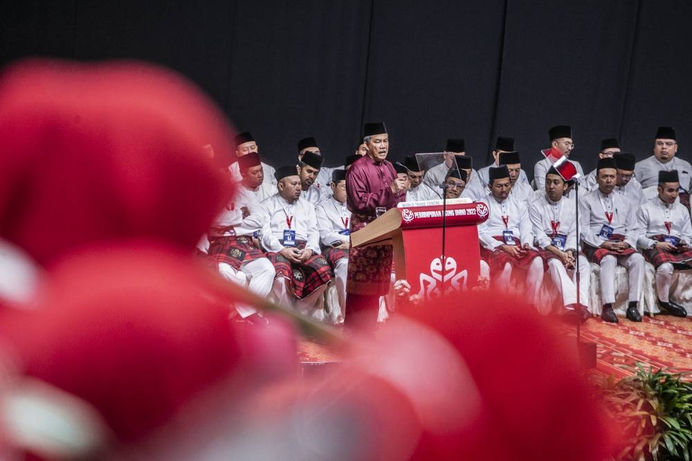 Umno deputy president Datuk Seri Mohamad Hasan gives his opening speech during Umno's general assembly at World Trade Centre Kuala Lumpur January 11, 2023. — Picture by Hari Anggara