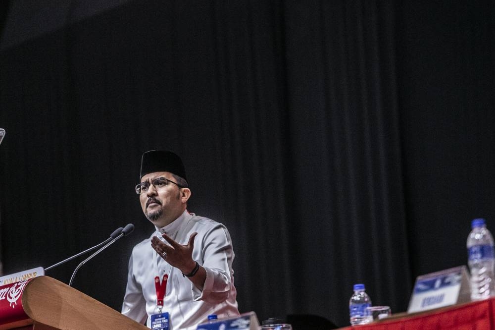 Umno Youth chief Datuk Asyraf Wajdi Dusuki speaks during the Umno Youth Conference at World Trade Centre in Kuala Lumpur January 12, 2023. — Picture by Hari Anggara