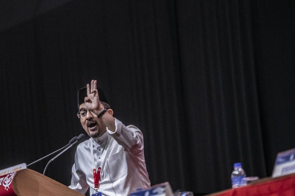 Umno Youth chief Datuk Asyraf Wajdi Dusuki speaks during the Umno Youth Conference at World Trade Centre in Kuala Lumpur January 12, 2023. — Picture by Hari Anggara