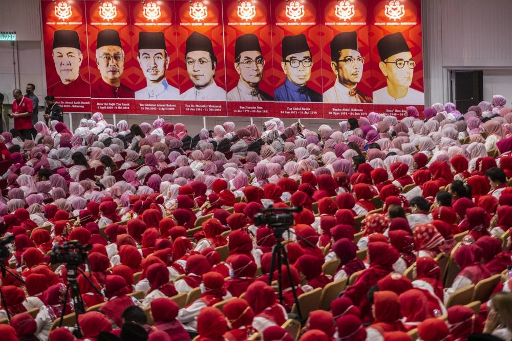 Umno delegates listen to a speech by deputy president Datuk Seri Mohamad Hasan at World Trade Centre Kuala Lumpur January 11, 2023. — Picture by Hari Anggara